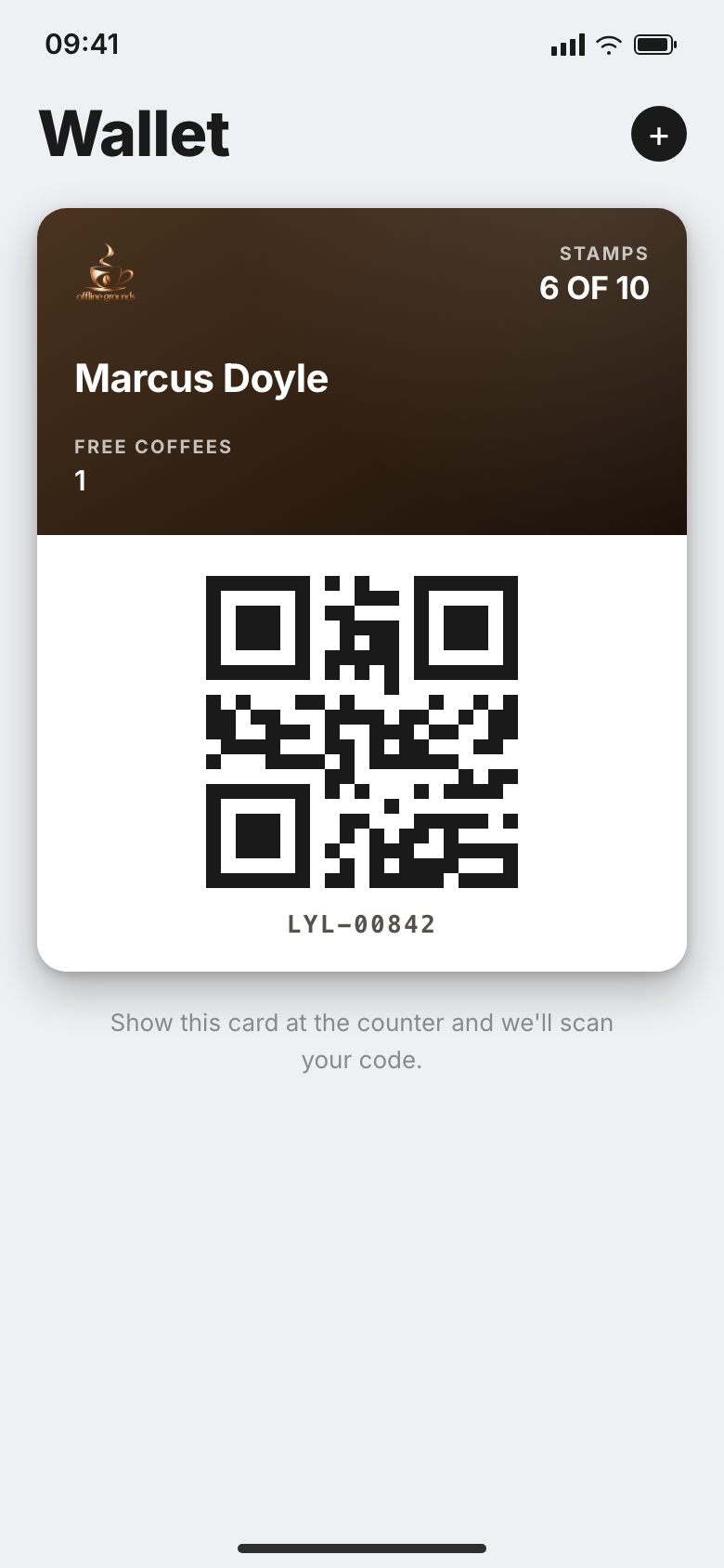 The Offline Grounds loyalty card open in Apple Wallet on an iPhone: 6 of 10 stamps, the customer's name, a free coffee banked, and the QR code to scan at the till.